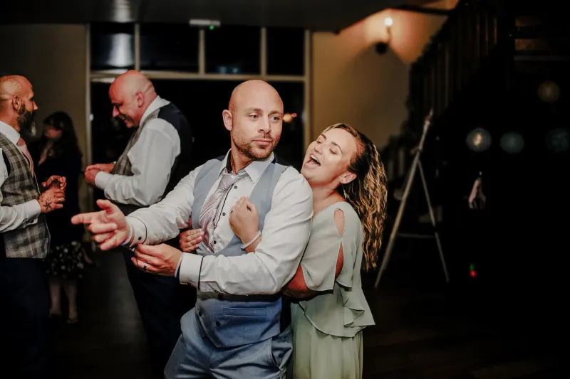 A couple dancing together during a wedding reception.
